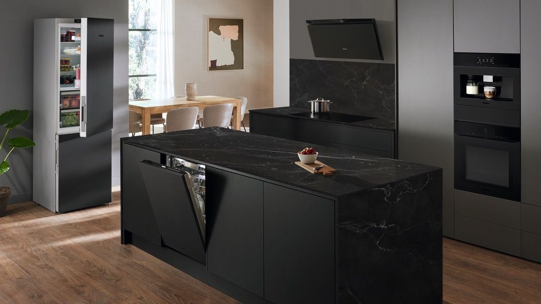 Black kitchen with matt black Miele appliances
