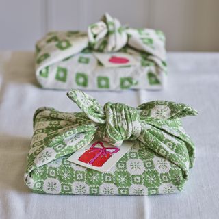 Green and white fabric gift wrapped presents