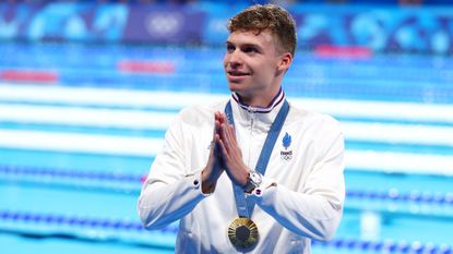 France&#039;s Léon Marchand soaks up the applause after winning gold in the men&#039;s 200m breaststroke