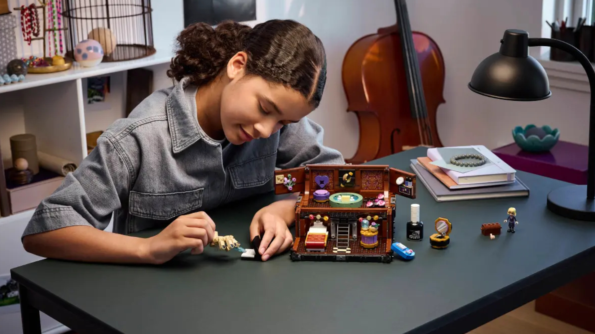 Lego Thing&#039;s Apartment set on a table, being played with by a girl