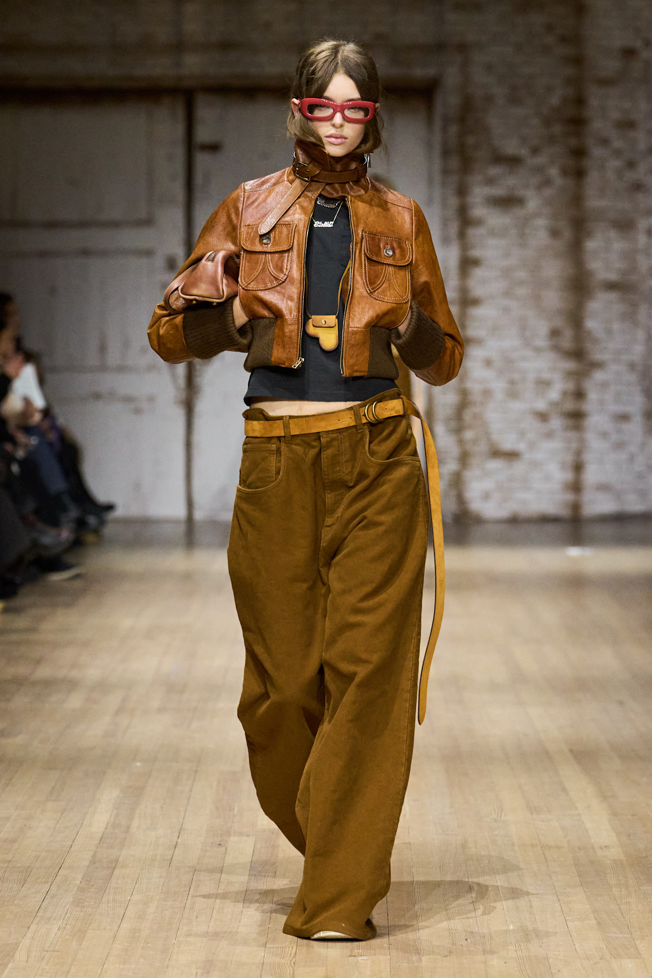 A model wore black and brown on the Coach Fall 2025 runway