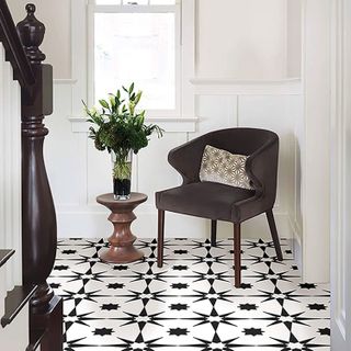 black and white star patterned vinyl floor tiles in hallway