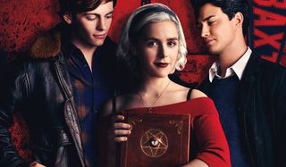Chilling Adventures Of Sabrina Harvey and Nick fawn over Sabrina, holding a spell book