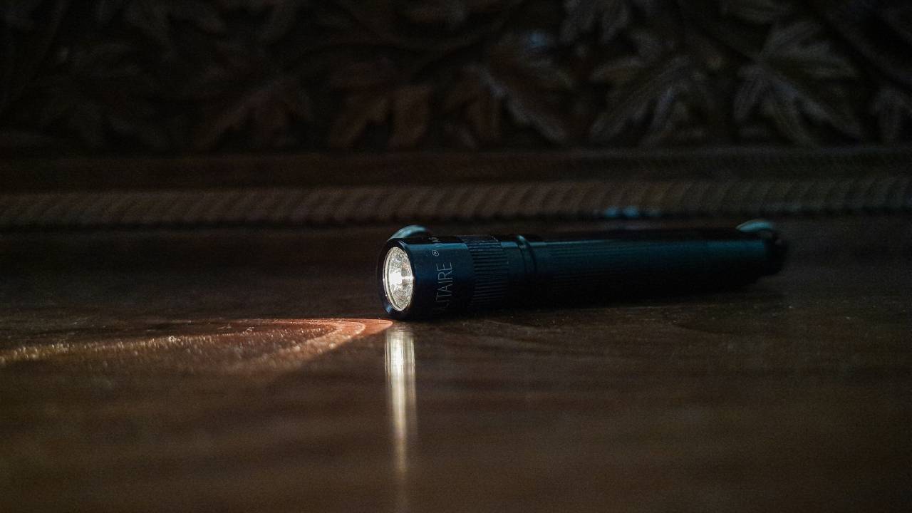 An illuminated torch in the dark
