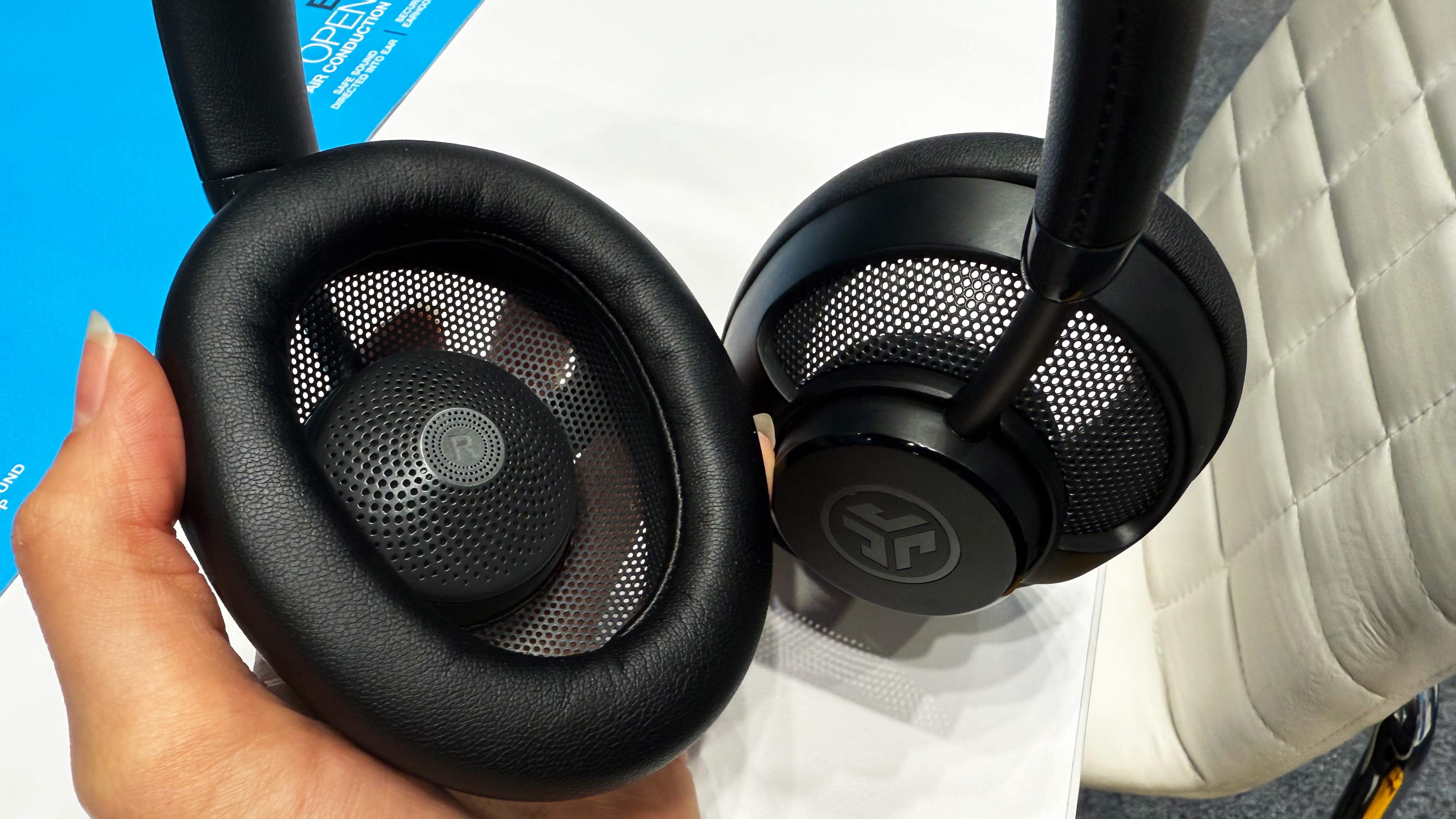 the JLab JBuds Open Headphones with mesh grille back and open back design in black