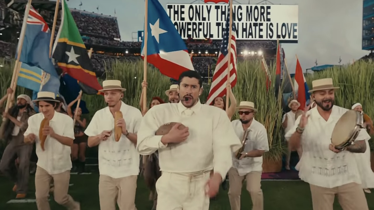 Bad Bunny standing in front of various flags Super Bowl LX Halftime Show