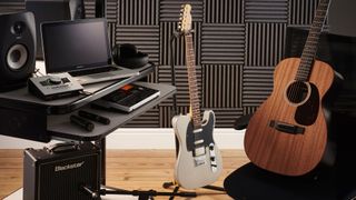 Recording studio with guitars, amp and computer