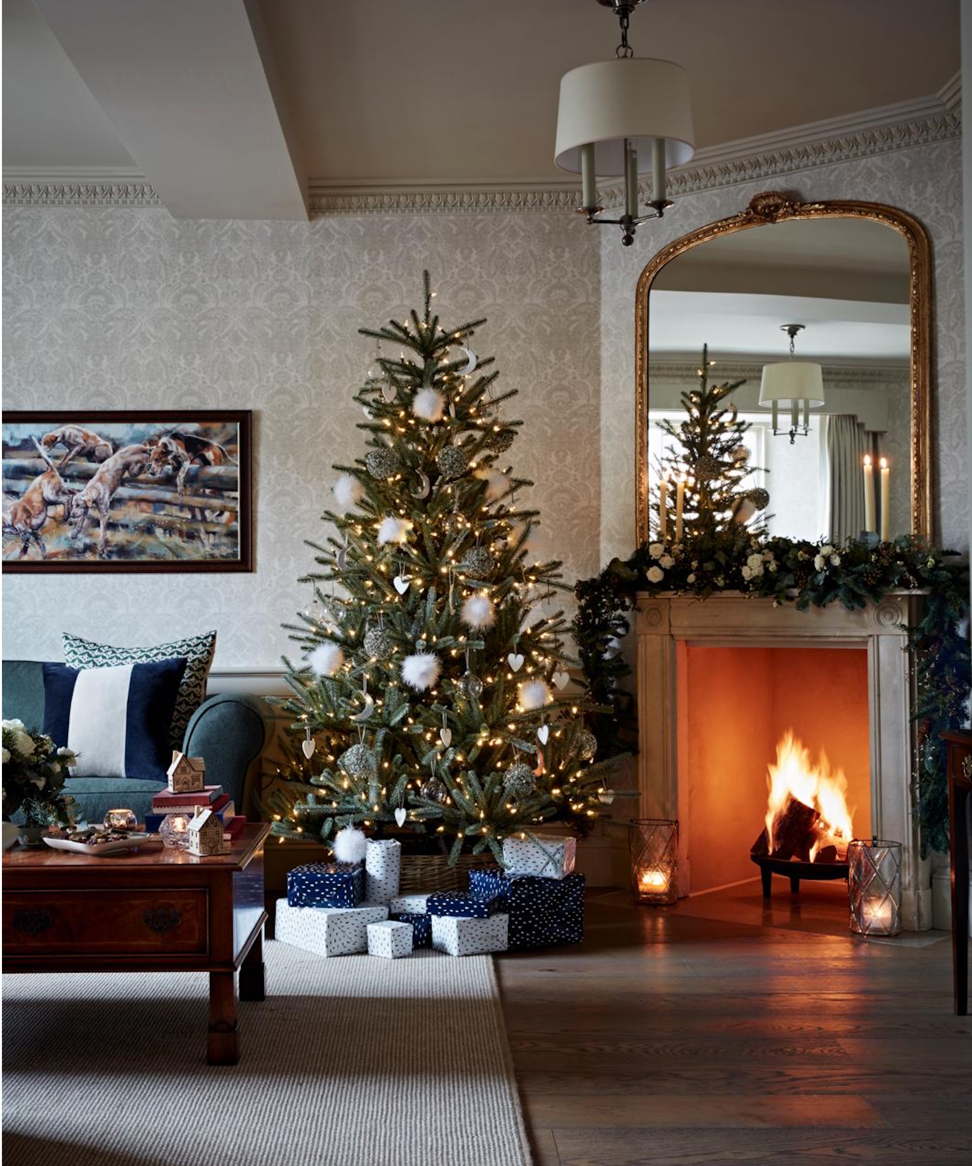 Christmas tree near fireplace