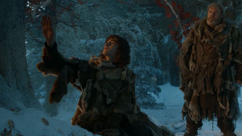 Bran reaching up towards a Weirwood Tree as Hodor looks on in Game Of Thrones