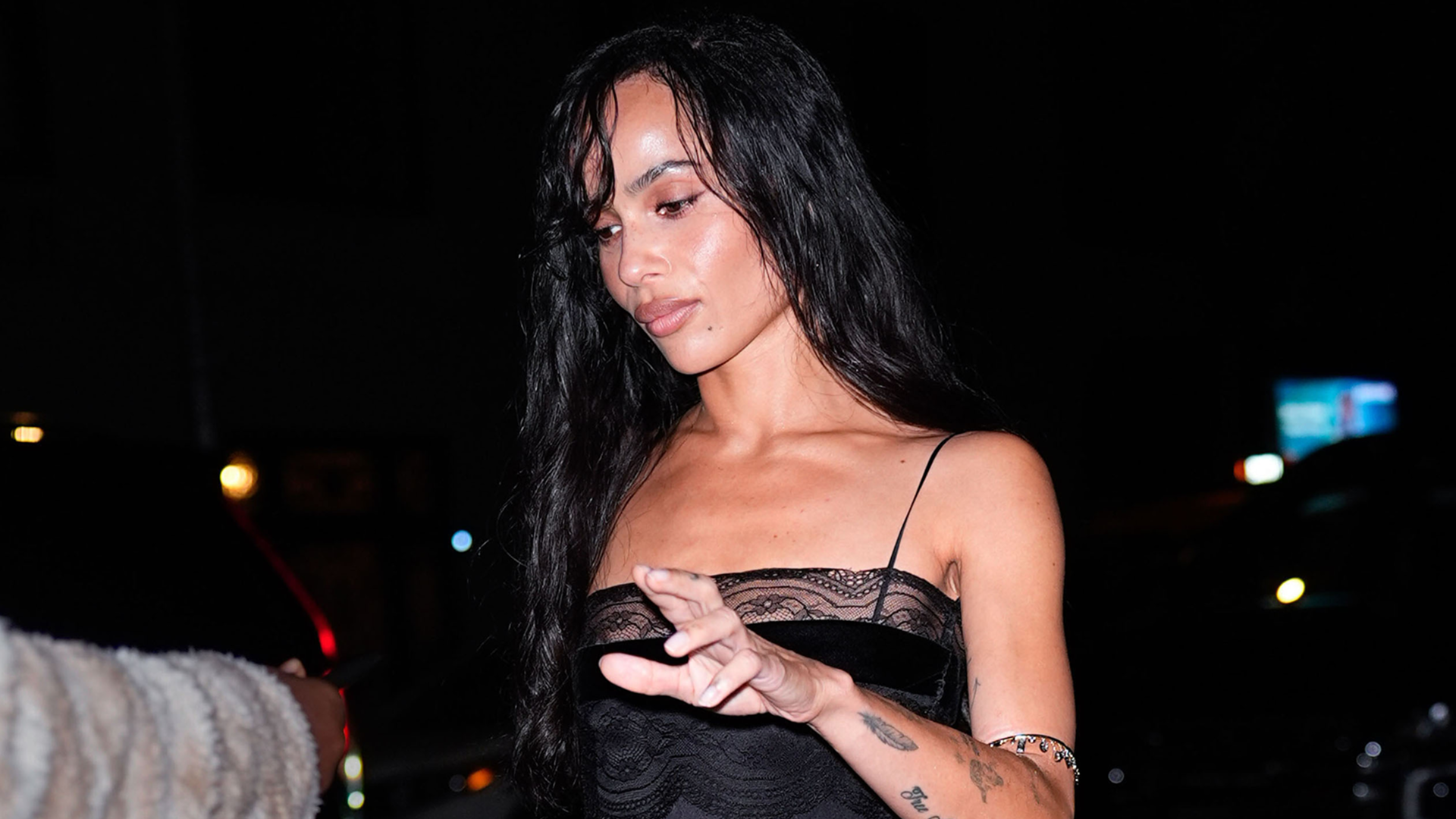 Zoë Kravitz attended a Jessica McCormack New York Fashion Week event in a lingerie-inspired Saint Laurent LBD