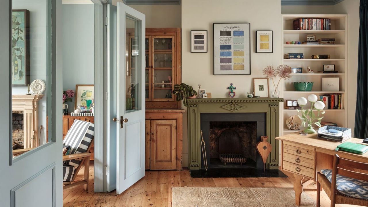 Light blue living room with green fireplace 