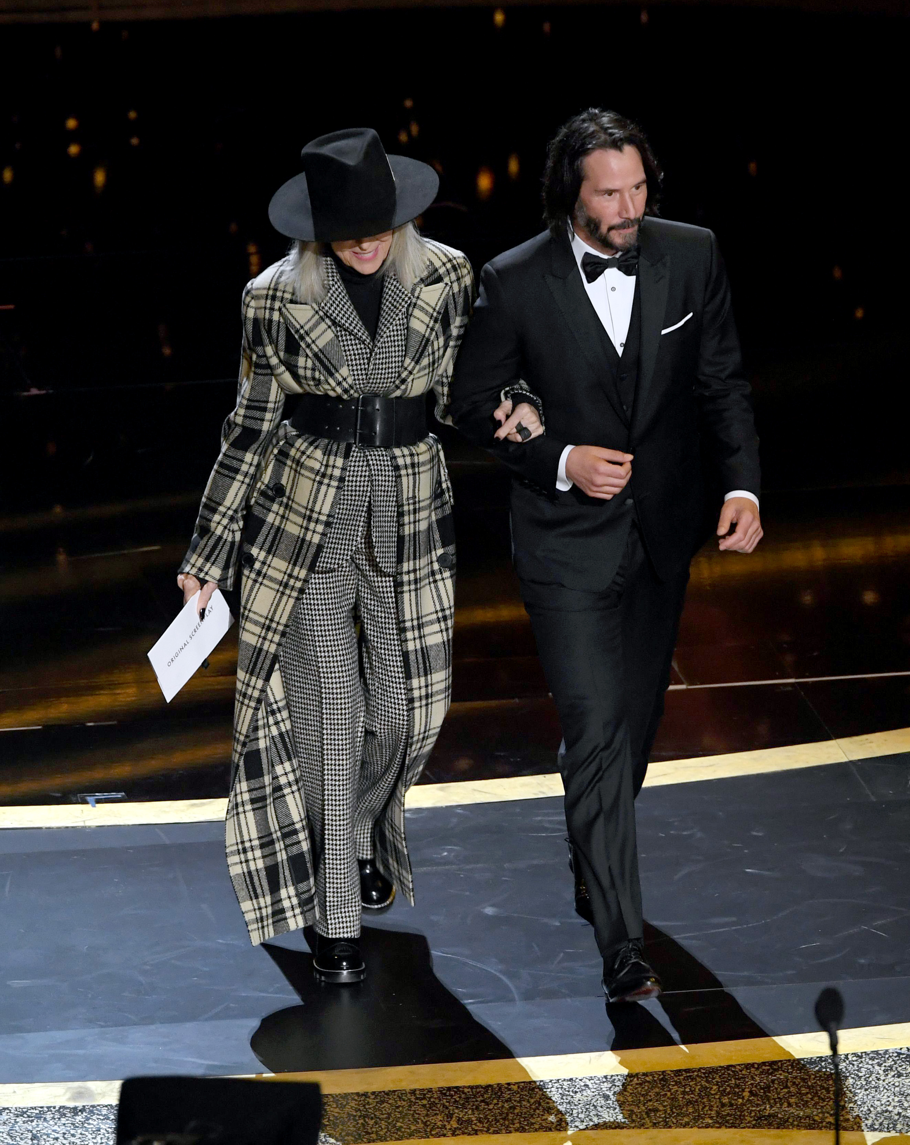 Diane Keaton's style evolution: Diane Keaton and Keanu Reeves walk onstage during the 92nd Annual Academy Awards at Dolby Theatre on February 09, 2020 in Hollywood, California.