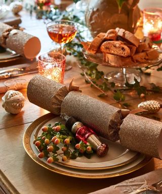 Christmas table setting with glittery cracker