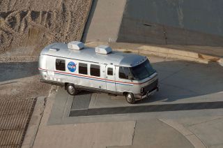 The original Airstream Astrovan is seen arriving at the launchpad with Chris Ferguson and final crew of the space shuttle.