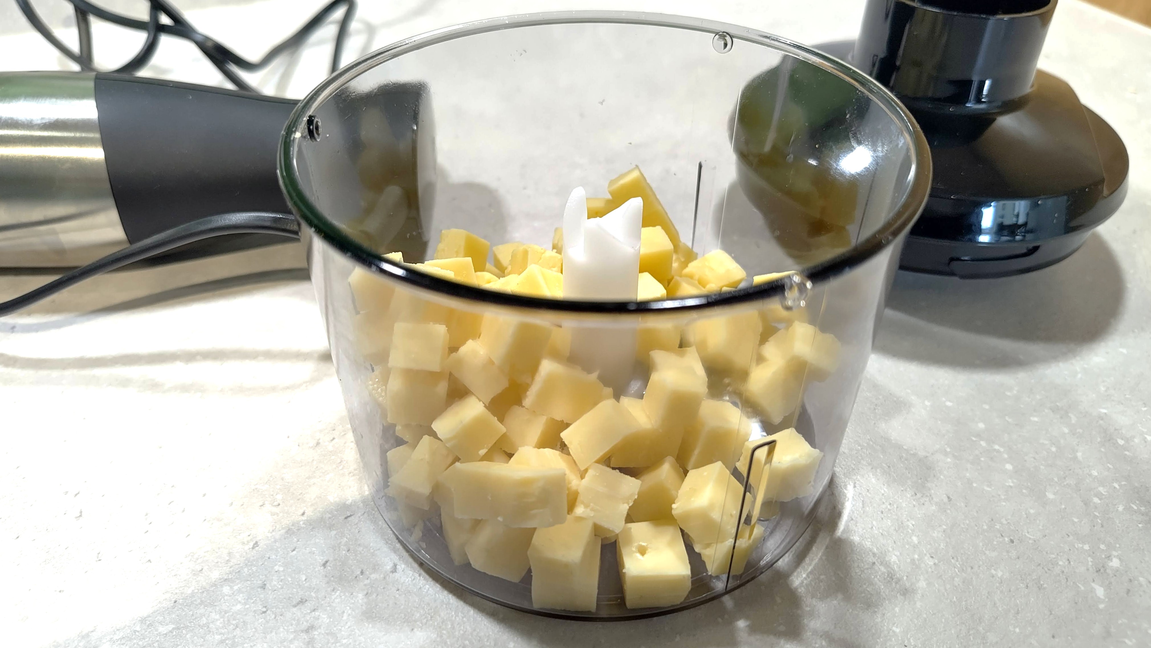 Cubed cheese ready for chopping with Bosch ErgoMaster Serie 3 blender