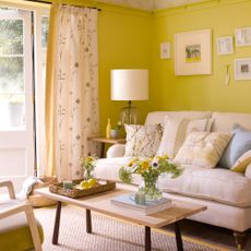 yellow living room with french doors