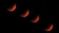 A multiple exposure picture of the &lsquo;blood moon&rsquo; over Golaghat in Assam, India.