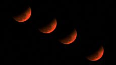 A multiple exposure picture of the &lsquo;blood moon&rsquo; over Golaghat in Assam, India.