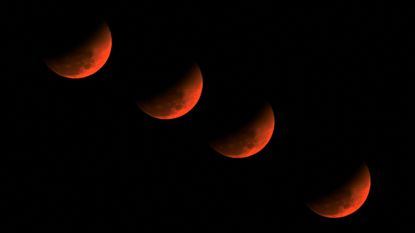 A multiple exposure picture of the &lsquo;blood moon&rsquo; over Golaghat in Assam, India.