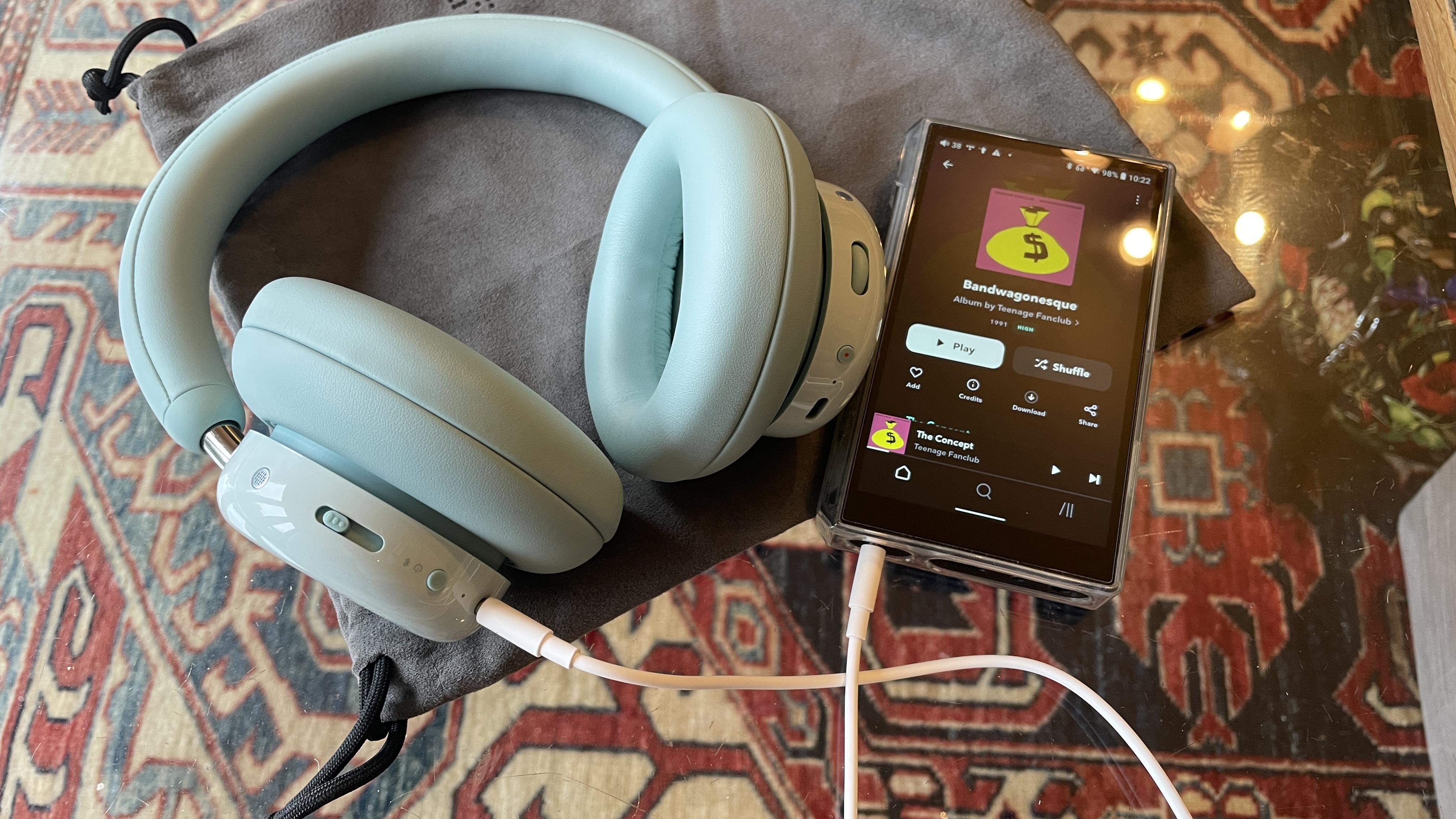 CMF Headphone Pro either beside Nothing Headphone (1) or on a table, with the accessories in the box