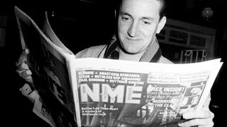 Paul Heaton of Beautiful South reading a copy of music magazine the NME, United Kingdom, March 1991