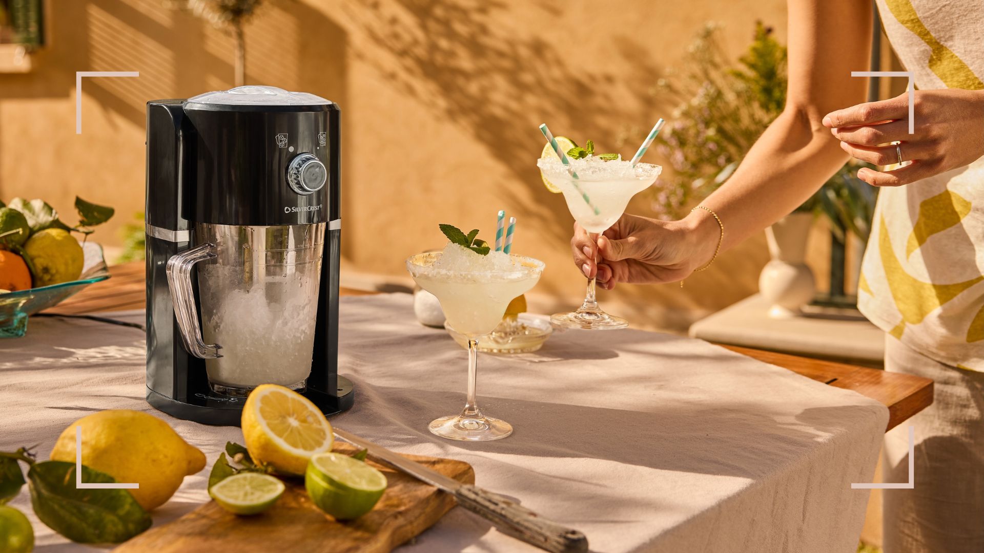 Outdoor table in summer with frozen drinks next to the Lidl slushy maker