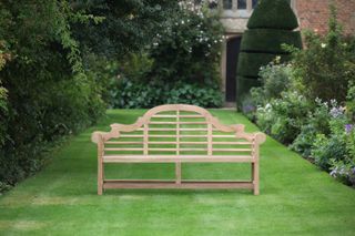 wooden bench on lawn