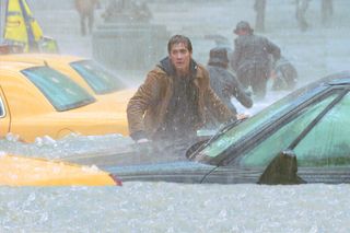 jack gyllenhaal runs through a flooded street in The Day After Tomorrow