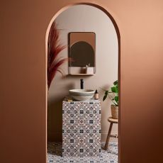 Terracotta bathroom with patterned tiles