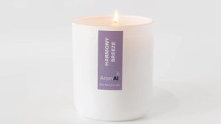 AromAI candle on a white background, lit and burning