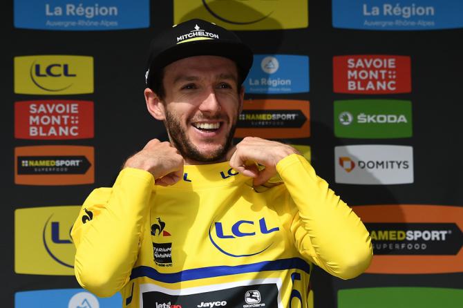 Adam Yates pulls on the yellow jersey after stage 6 at Dauphine