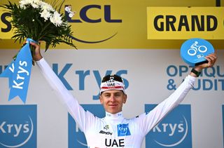 UAE Team Emirates teams Slovenian rider Tadej Pogacar wearing the best young riders white jersey celebrates on the podium after the 4th stage of the 109th edition of the Tour de France cycling race 1715 km between Dunkirk and Calais in northern France on July 5 2022 Photo by AnneChristine POUJOULAT AFP Photo by ANNECHRISTINE POUJOULATAFP via Getty Images