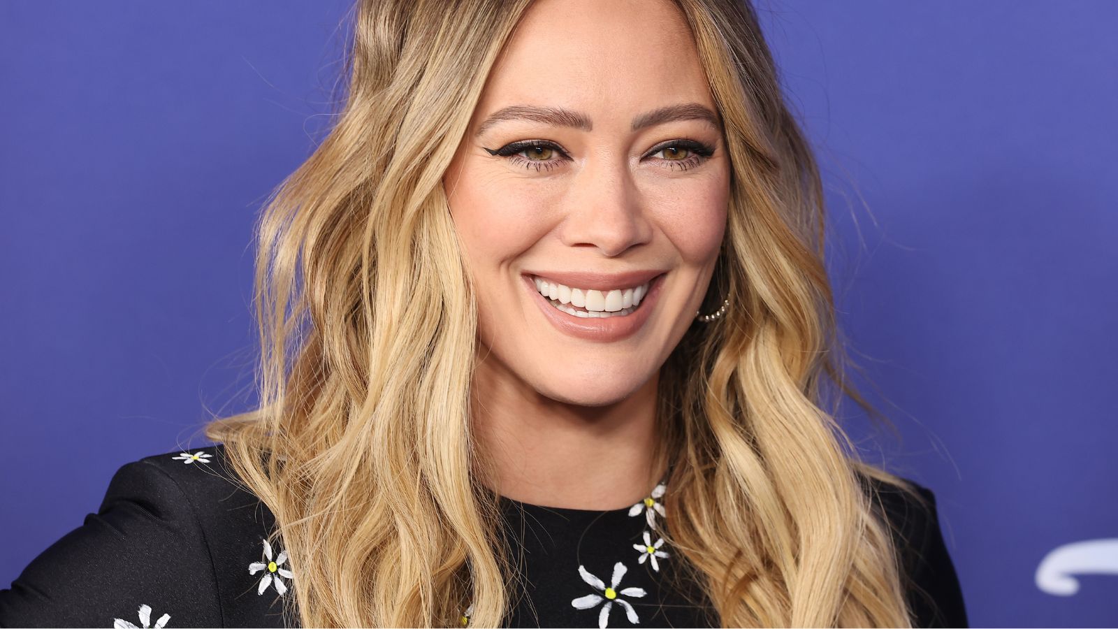 hilary duff on a purple backgorund