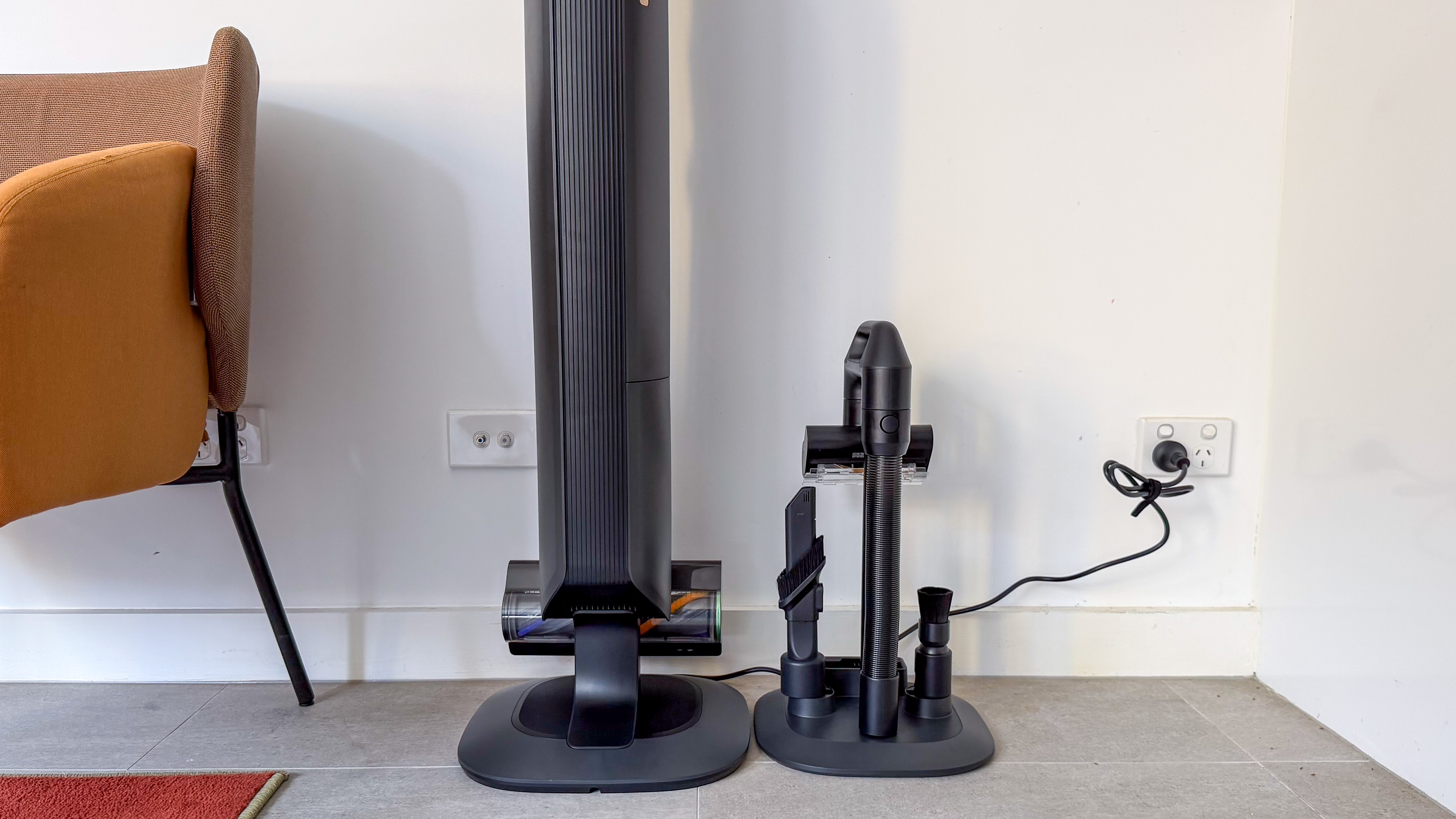 Dreame Z50 Station beside its accessory cradle on a tiled floor