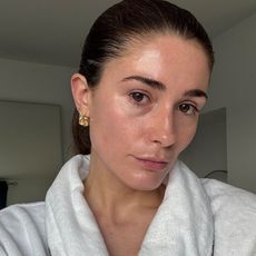 A selfie of beauty editor Eleanor in a white dressing gown after doing her skincare