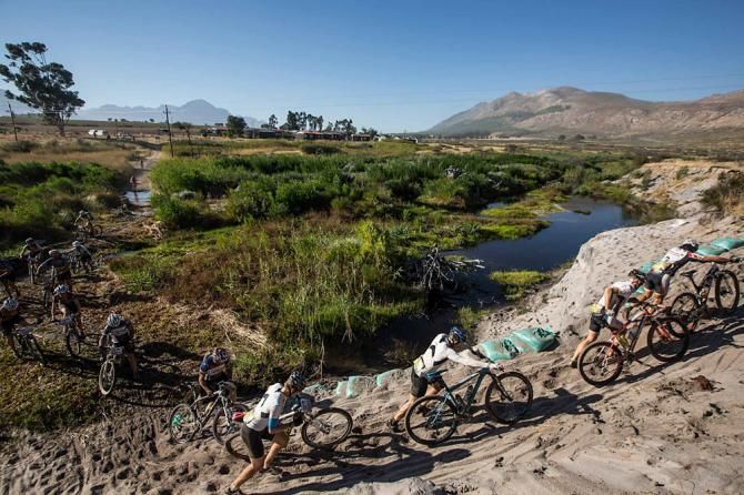 Riders navigate farm lands and water crossings