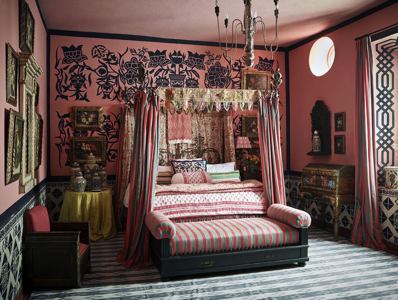 spare bedroom with four poster bed and red walls