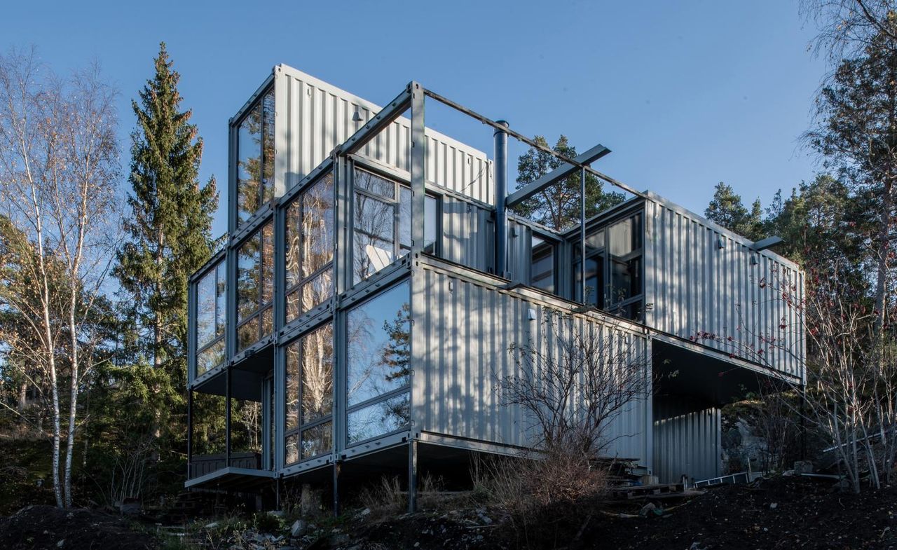 Hero exterior from the side against blue skies of the Container house in Sweden