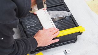 cutting tiles with a wet tile cutter