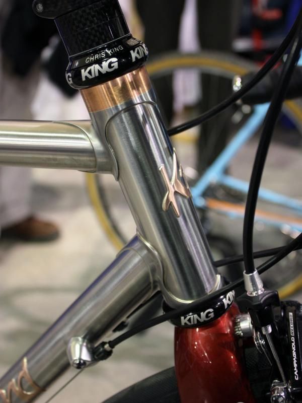 Copper accents offset the stark stainless steel on this Kelly Bedford road bike.