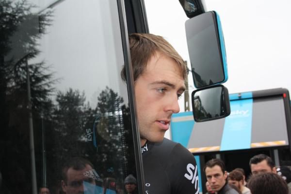 Alex Dowsett pops out of the Team Sky bus