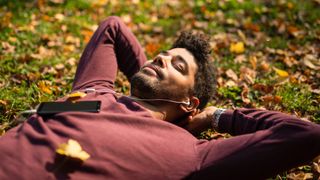 Man lying down while meditating