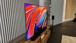 The Sony Bravia 9 photographed on a wooden stand in a lounge environment