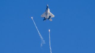 an F-22 Raptor firing flares