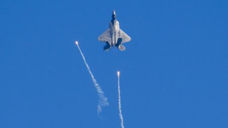 an F-22 Raptor firing flares