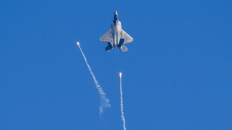 an F-22 Raptor firing flares