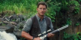 Chris Pratt holding rifle in Jurassic World