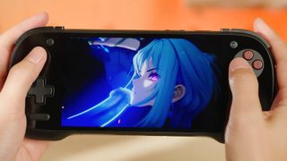 Hands holding KONKR Fit 8 Elite with anime character on screen.