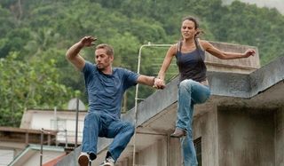 Brian and Mia jumping in Fast Five