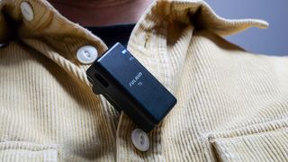 Fulaim X5M wireless microphone clipped to a person's shirt